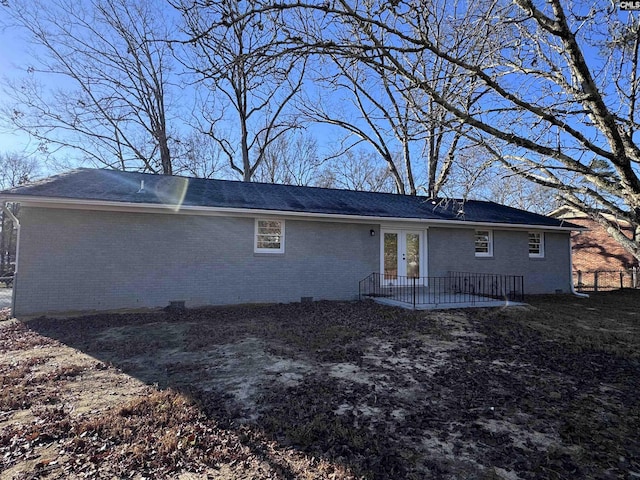 back of house featuring french doors