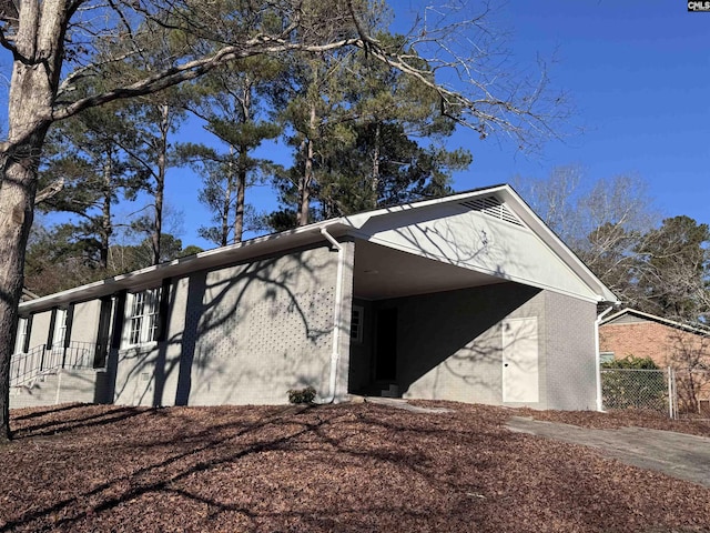 exterior space featuring a carport