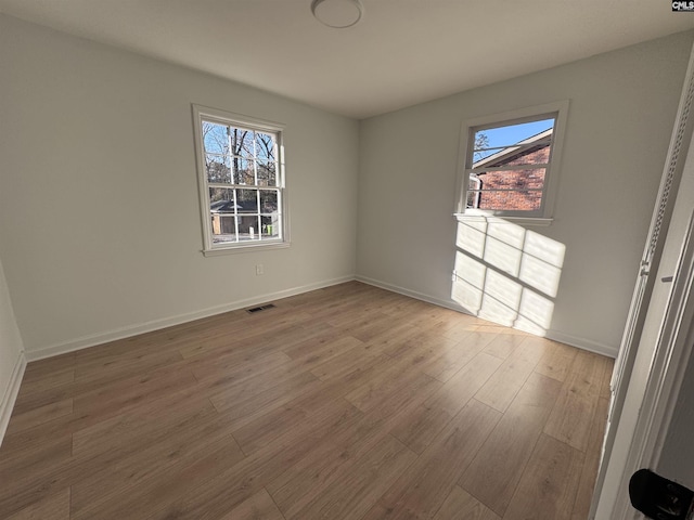 spare room featuring hardwood / wood-style flooring