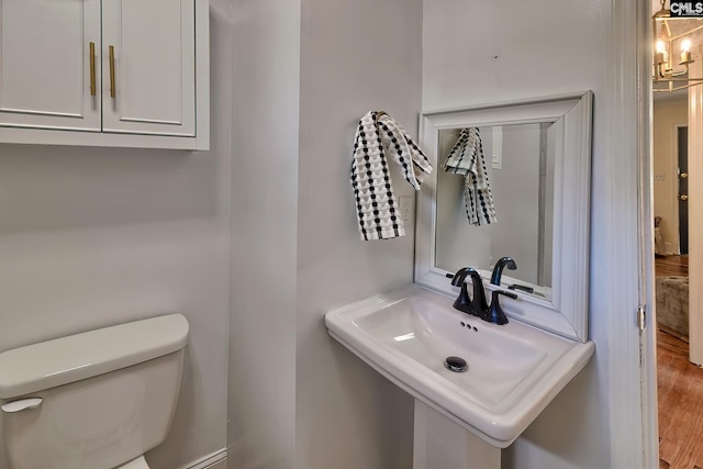 bathroom featuring sink and toilet