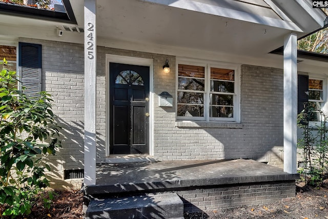 entrance to property with a porch