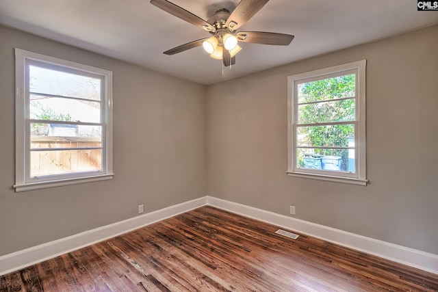 spare room featuring ceiling fan and hardwood / wood-style flooring