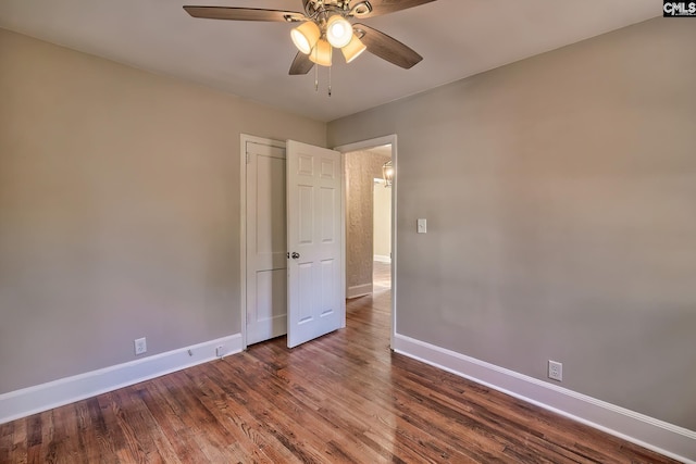 empty room with wood-type flooring and ceiling fan