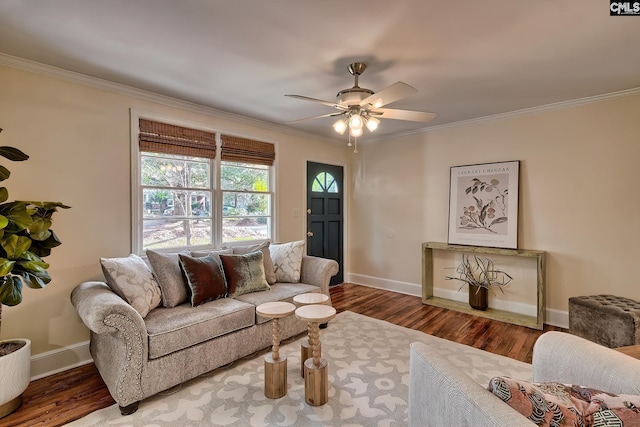 living room with crown molding, hardwood / wood-style floors, and ceiling fan