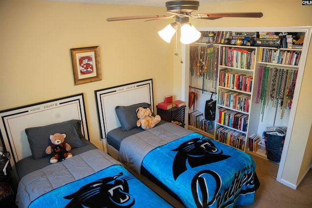 carpeted bedroom featuring ceiling fan