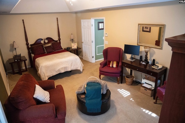 bedroom featuring light carpet and lofted ceiling