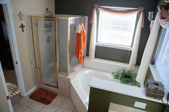 bathroom featuring shower with separate bathtub and tile patterned floors