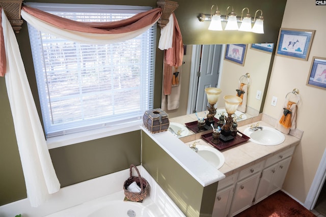 bathroom with a tub to relax in and vanity