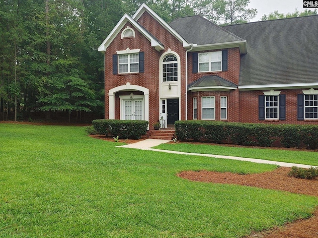 view of front of house with a front lawn