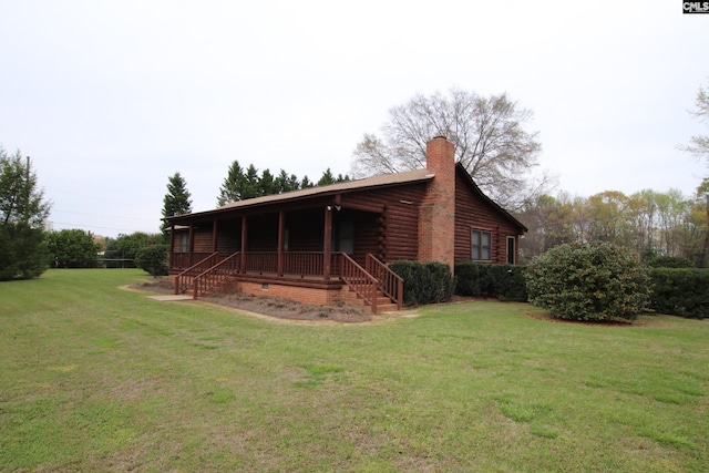 view of home's exterior with a lawn and a porch