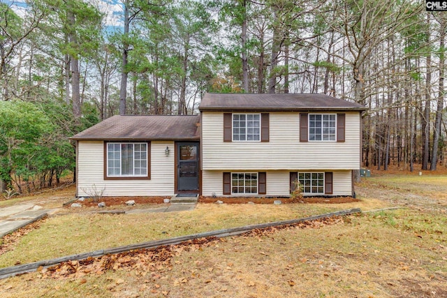 split level home with a front lawn