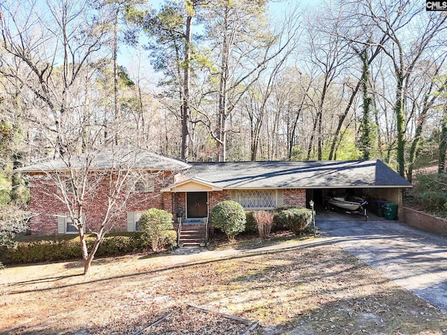 view of front of property featuring a carport