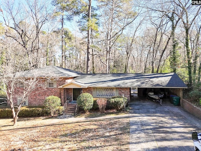 view of front of home with a carport