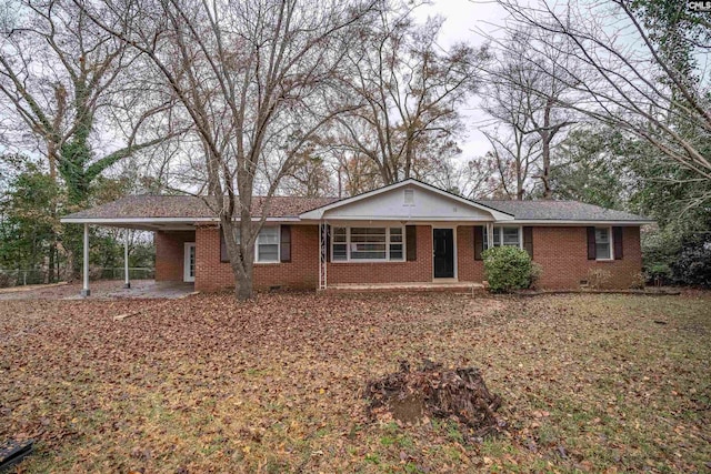 single story home featuring a carport