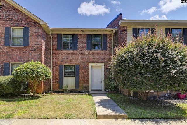 view of front of house with a front lawn