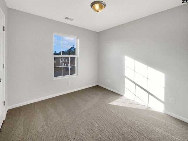 empty room featuring carpet flooring