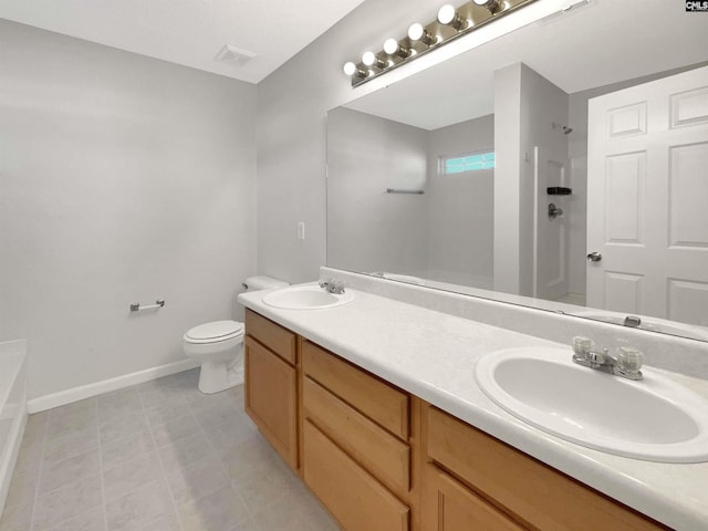 bathroom with toilet, a shower, and vanity