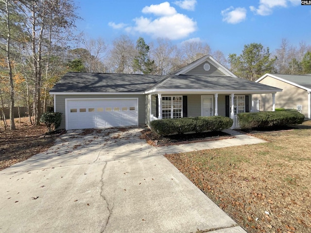 single story home featuring a front lawn and a garage