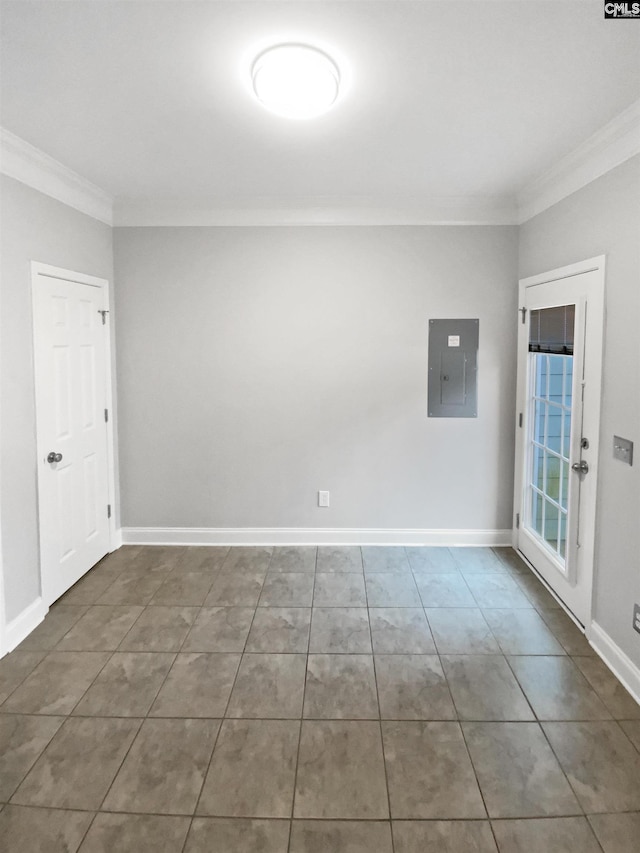 tiled empty room with electric panel and ornamental molding