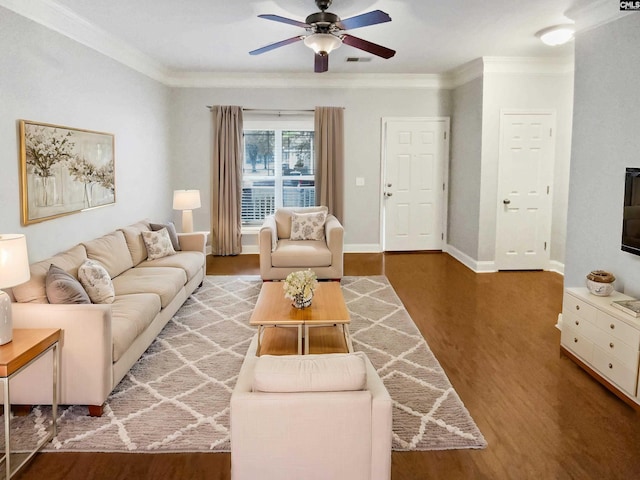 living room featuring hardwood / wood-style flooring, ceiling fan, and ornamental molding