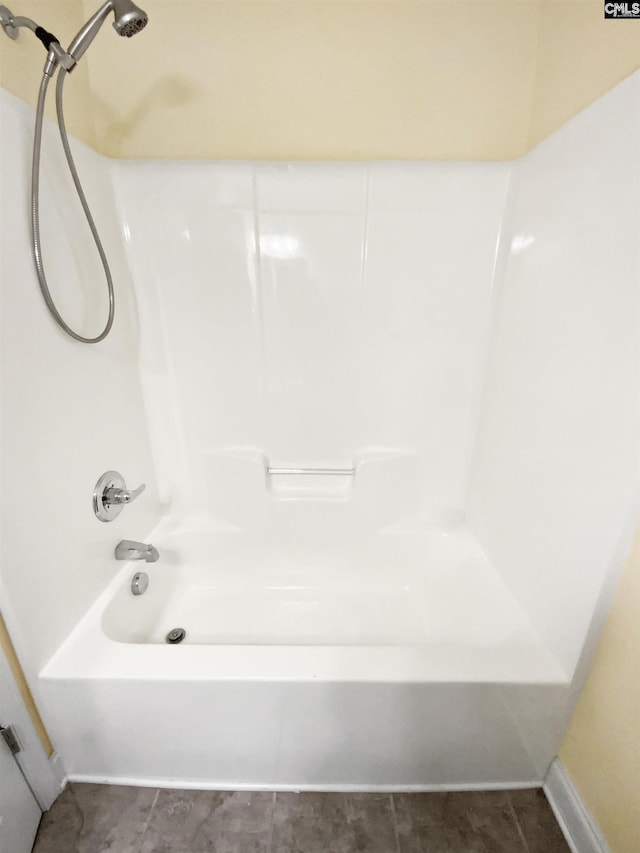 bathroom featuring tile patterned floors and shower / tub combination