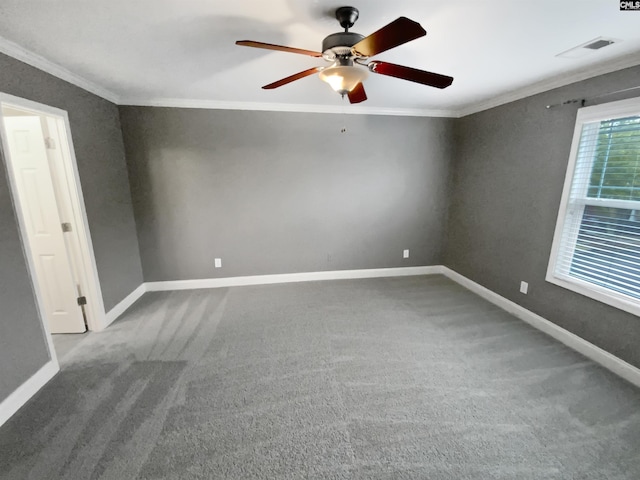 spare room with carpet, ceiling fan, and ornamental molding