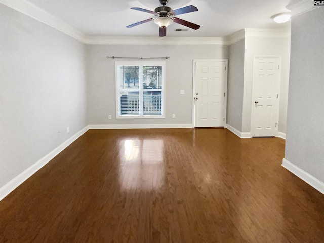 empty room with dark wood-type flooring, ceiling fan, and crown molding