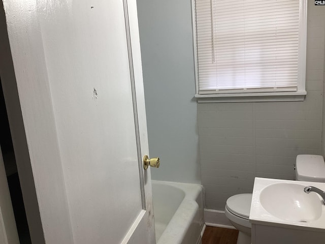 full bathroom featuring wood-type flooring, vanity, toilet, and shower / tub combination