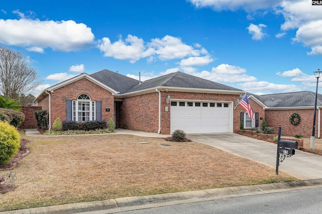 ranch-style house featuring a front yard and a garage