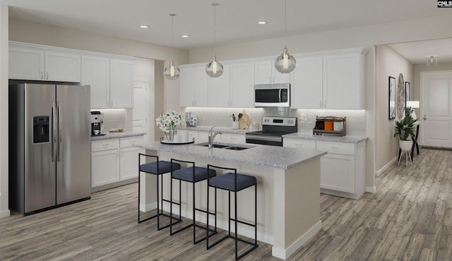 kitchen with white cabinets and appliances with stainless steel finishes