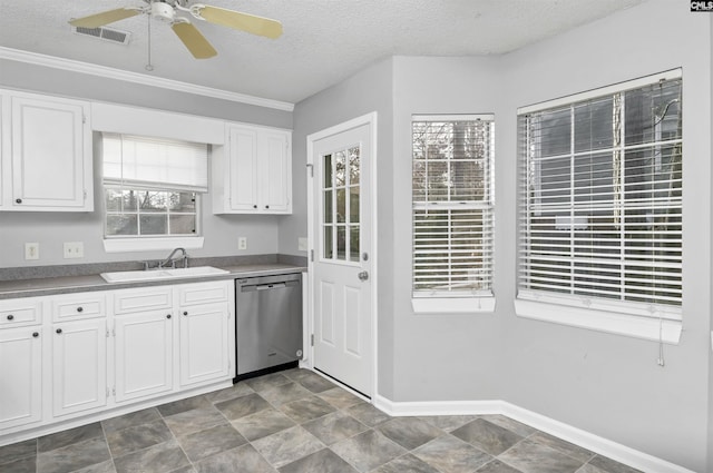 kitchen with a textured ceiling, dishwasher, white cabinetry, and sink