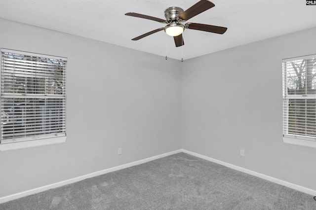 unfurnished room with carpet flooring and ceiling fan