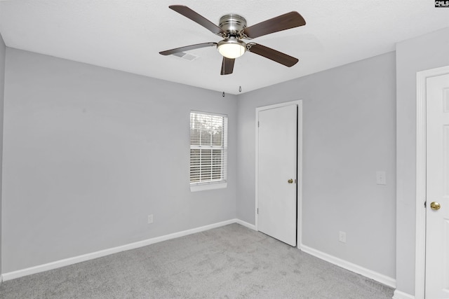 unfurnished bedroom with light carpet and ceiling fan