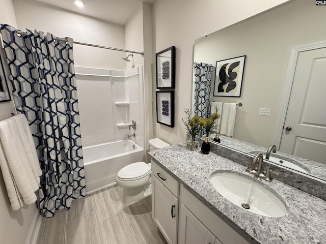 full bath featuring toilet, shower / bathtub combination with curtain, and vanity