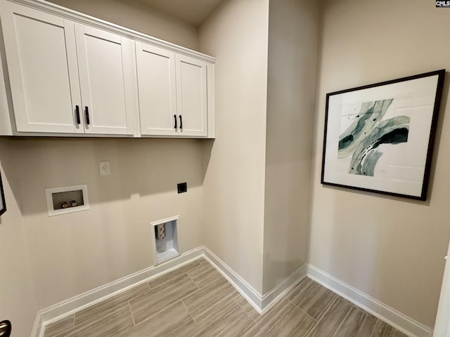 laundry room featuring cabinet space, baseboards, wood finish floors, washer hookup, and electric dryer hookup