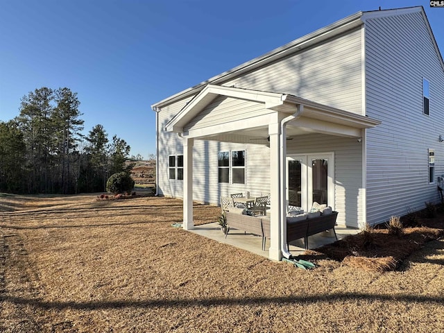 back of property featuring a patio area