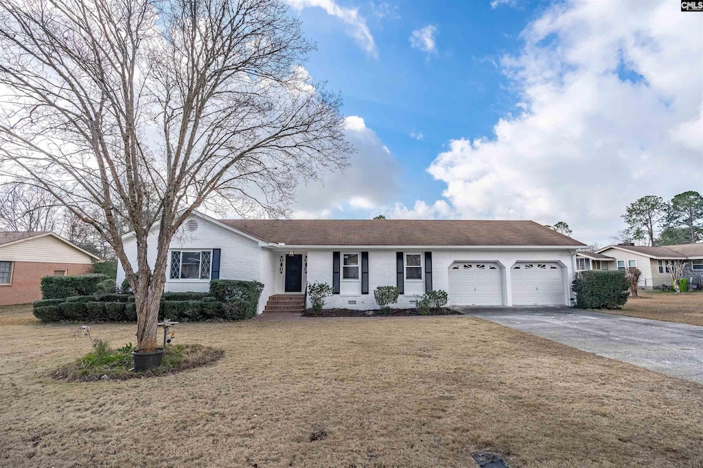 single story home featuring a front lawn and a garage