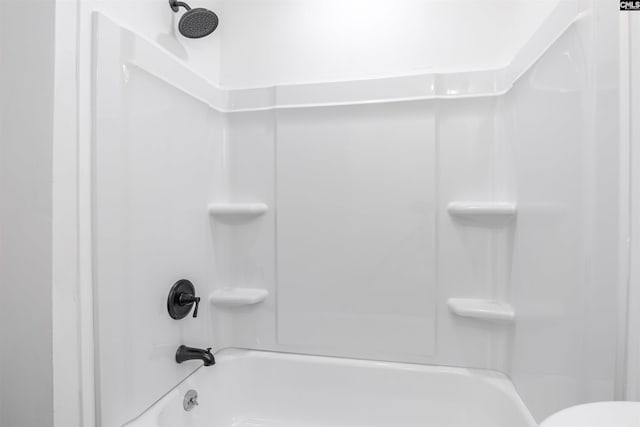 bathroom with bathing tub / shower combination