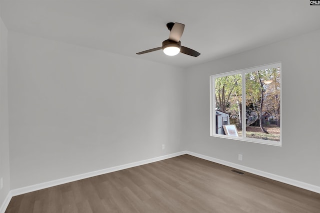 empty room featuring hardwood / wood-style flooring and ceiling fan