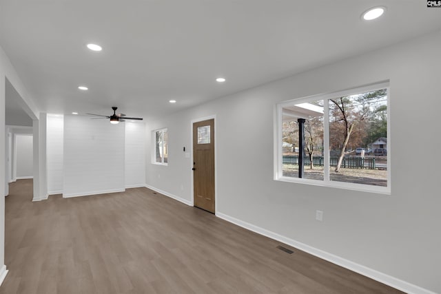 entryway with ceiling fan and hardwood / wood-style flooring