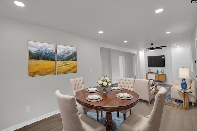 dining space featuring hardwood / wood-style floors and ceiling fan