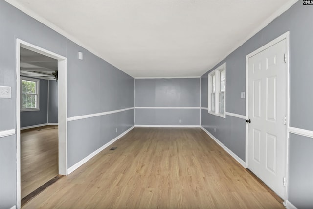 empty room featuring light hardwood / wood-style flooring and ceiling fan