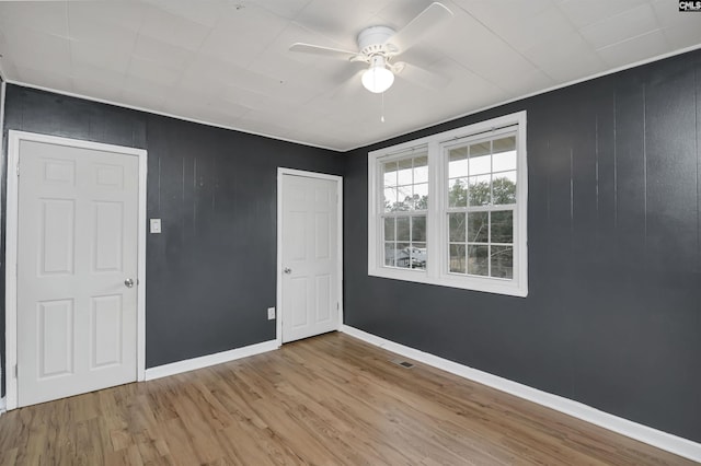 unfurnished bedroom featuring ceiling fan and light hardwood / wood-style floors