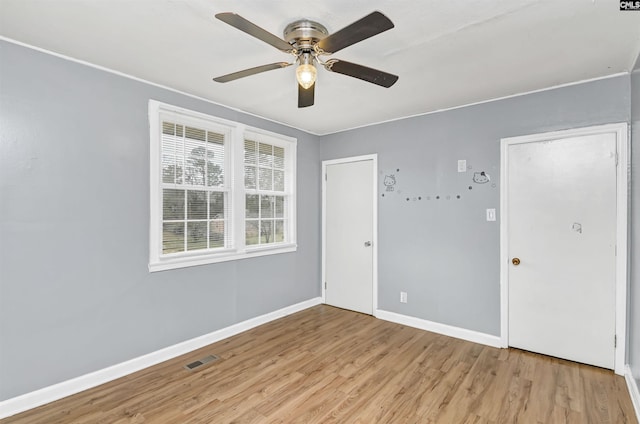 spare room featuring ceiling fan and light wood-type flooring