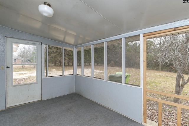 unfurnished sunroom with lofted ceiling