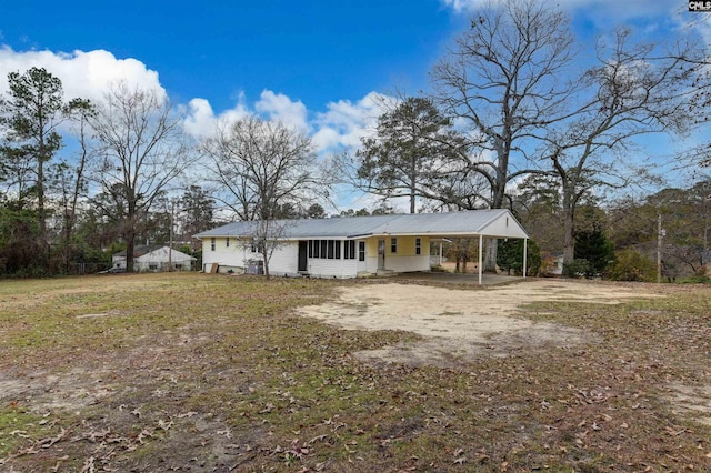 exterior space featuring a carport