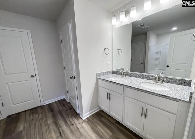 bathroom featuring vanity and hardwood / wood-style floors