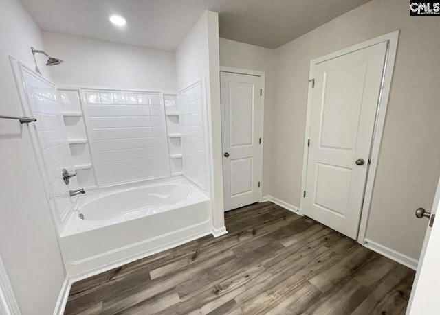 bathroom with tub / shower combination and wood-type flooring