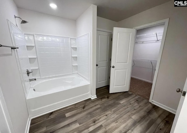 bathroom with shower / bath combination and wood-type flooring