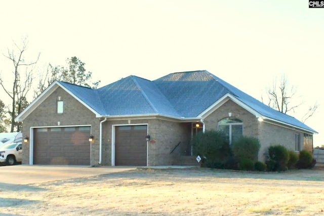 single story home featuring a garage